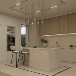 Solo Design Studio Izabela Czerwik - Elegancka kuchnia w jasnych barwach z wyspą i hokerami. Minimalistyczne oświetlenie wiszące. Widoczne wbudowane sprzęty i dekoracje roślinne. Ujęcie z niskiego kąta.