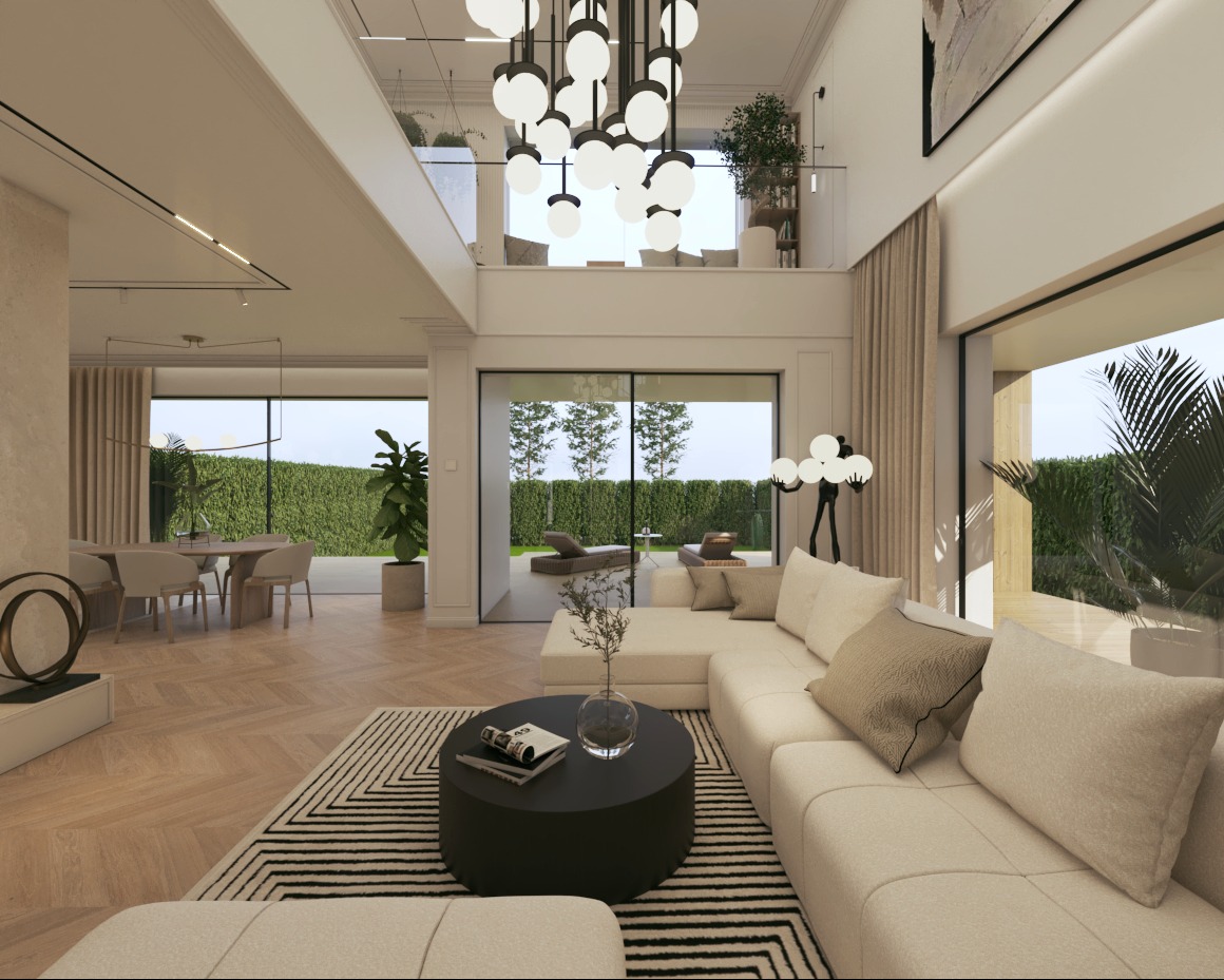 Przestronny salon w jasnych barwach z dużymi oknami i nowoczesnym oświetleniem. Widoczny narożnik, stolik kawowy i strefa jadalna. Za oknami bujna zieleń.