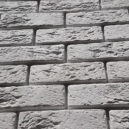 Szara ściana z dekoracyjnej cegły o nieregularnej fakturze, imitująca starą cegłę, z widocznymi spoinami.