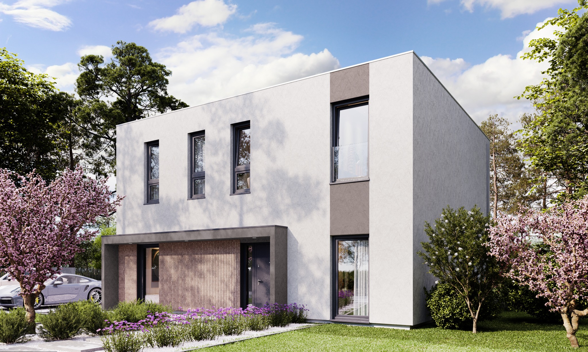 Dwukondygnacyjny, nowoczesny dom o prostej bryle, z białymi ścianami, szarymi akcentami i dużymi oknami, otoczony kwitnącymi drzewami i zadbanym trawnikiem, z widocznym fragmentem sportowego...