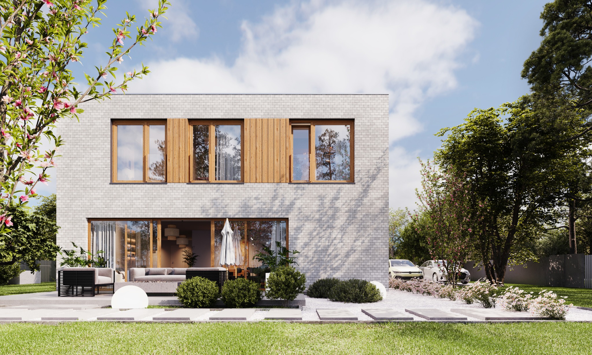 Dwukondygnacyjny dom z białej cegły z drewnianymi akcentami, widok z zewnątrz na taras z meblami ogrodowymi i podjazd z samochodami, oświetlony kulistą lampą.