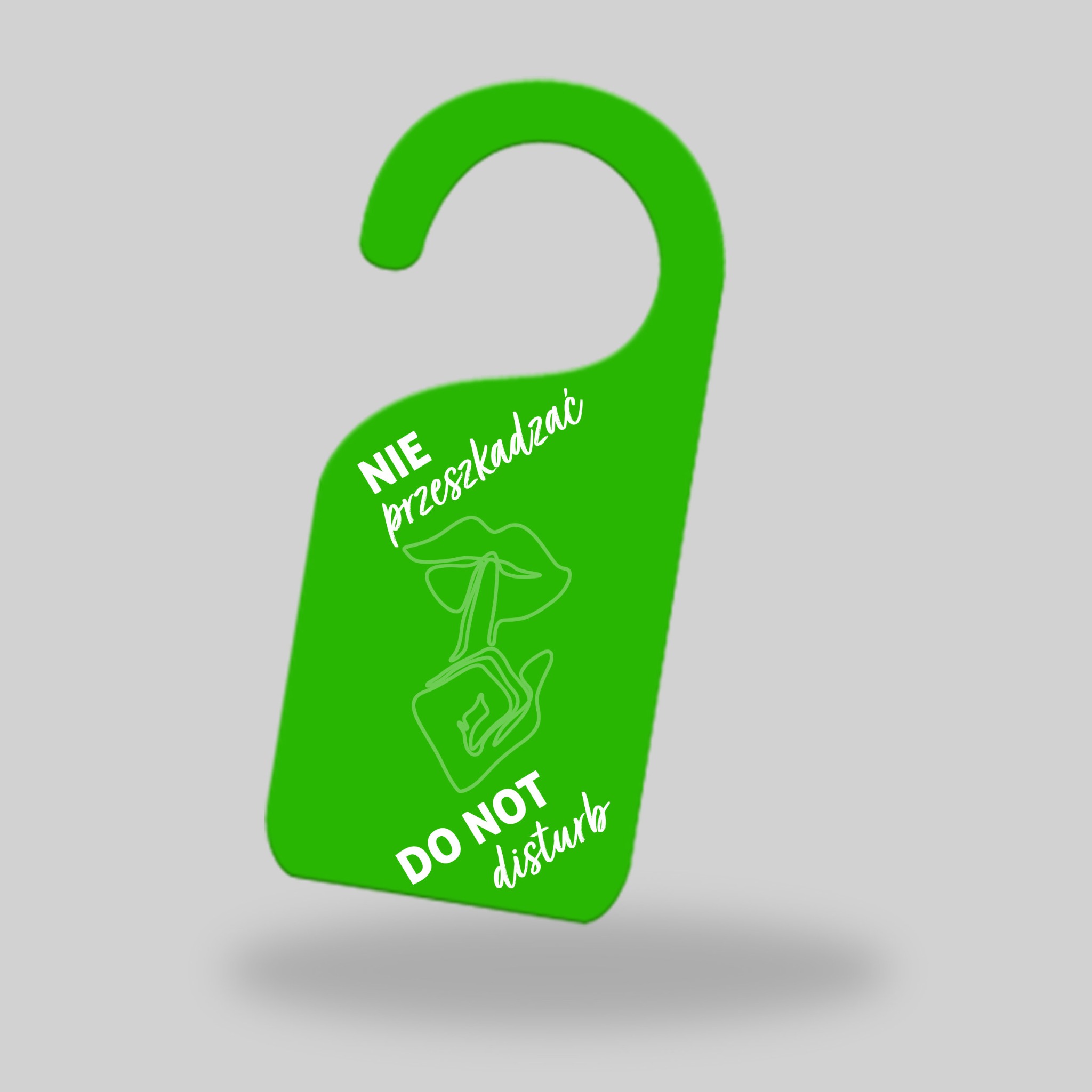 Zielona zawieszka na klamkę z napisem 'Nie przeszkadzać' i 'Do Not Disturb' oraz grafiką ust z palcem na tle szarego gradientu.