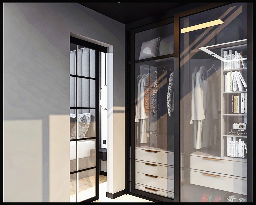 Nowoczesna garderoba z przesuwnymi drzwiami ze szkła, widok na sypialnię z łóżkiem z kamiennym wezgłowiem i czarną ramą okienną.