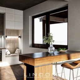 LINDOM ARCHITEKTURA SPÓŁKA Z OGRANICZONĄ ODPOWIEDZIALNOŚCIĄ - Wnętrze domu: nowoczesna kuchnia z drewnianą wyspą, hokerami o organicznym kształcie, jasnymi szafkami i wnęką z siedziskiem przy oknie. Parkiet w jodełkę, minimalistyczne oświetlenie i dekoracje...