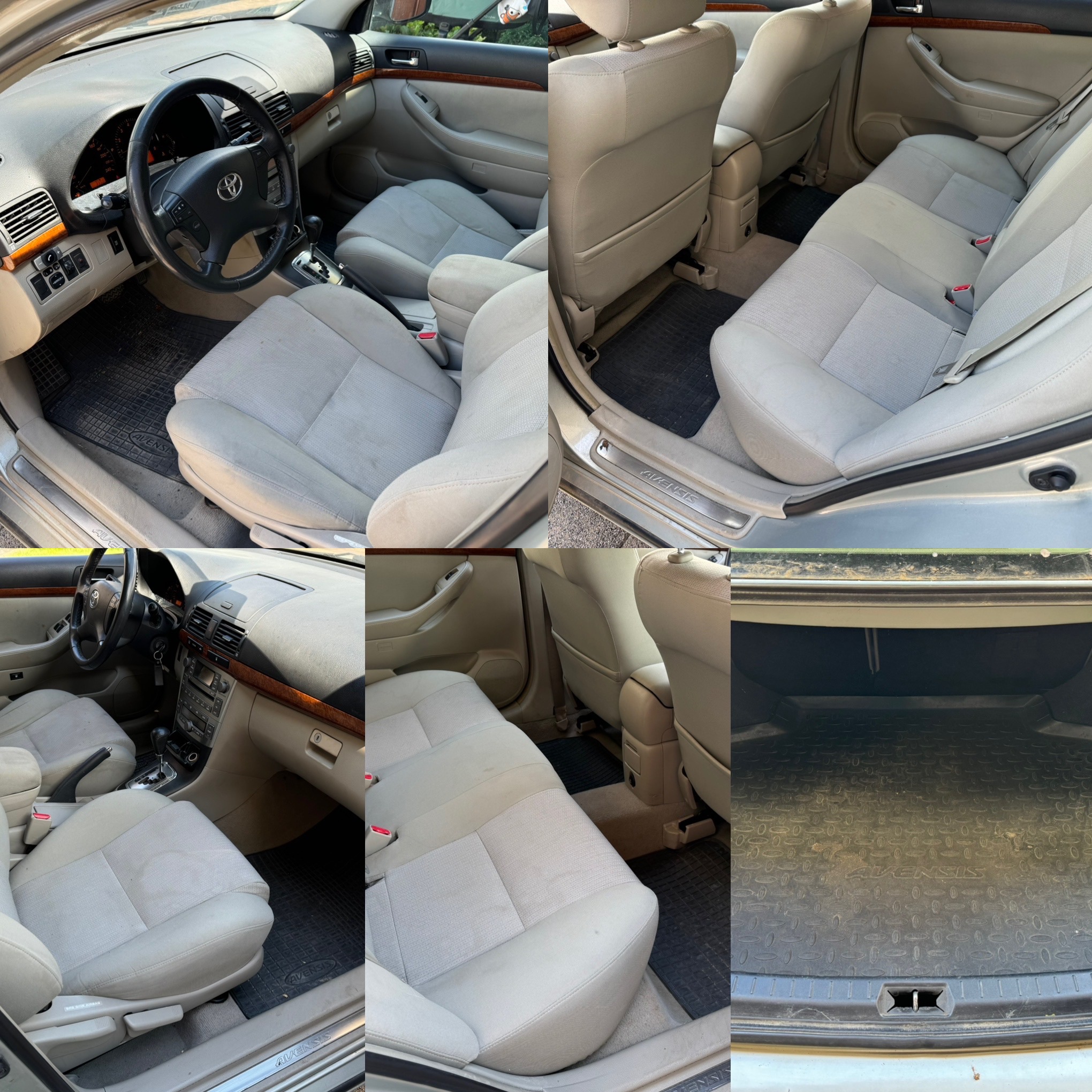 Wnętrze samochodu Toyota Avensis przed czyszczeniem, widoczne zabrudzenia na jasnej tapicerce foteli, dywanikach i w bagażniku, drewnopodobne wykończenie deski rozdzielczej.