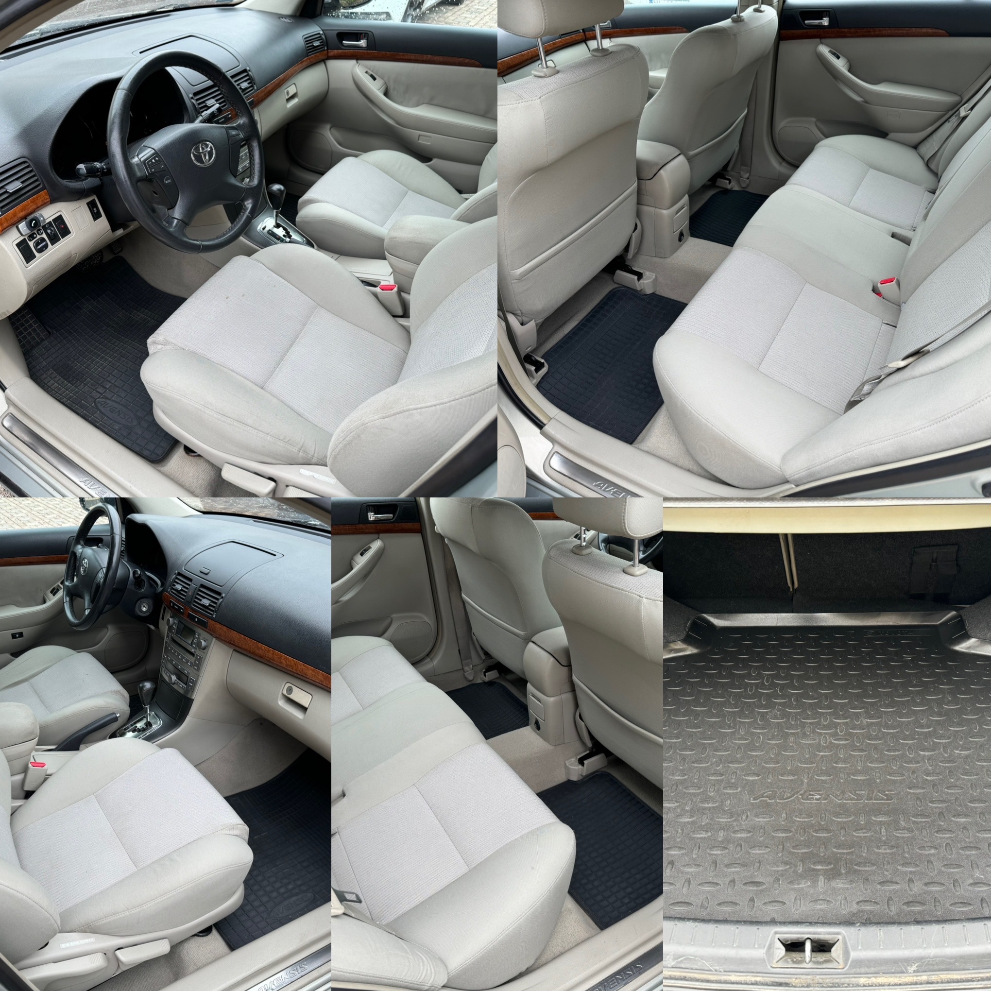 Wnętrze samochodu Toyota Avensis: jasnoszare tapicerki foteli i podłokietników, czarne gumowe dywaniki, deska rozdzielcza z elementami drewnopodobnymi, bagażnik z gumową wykładziną z napisem Avensis.