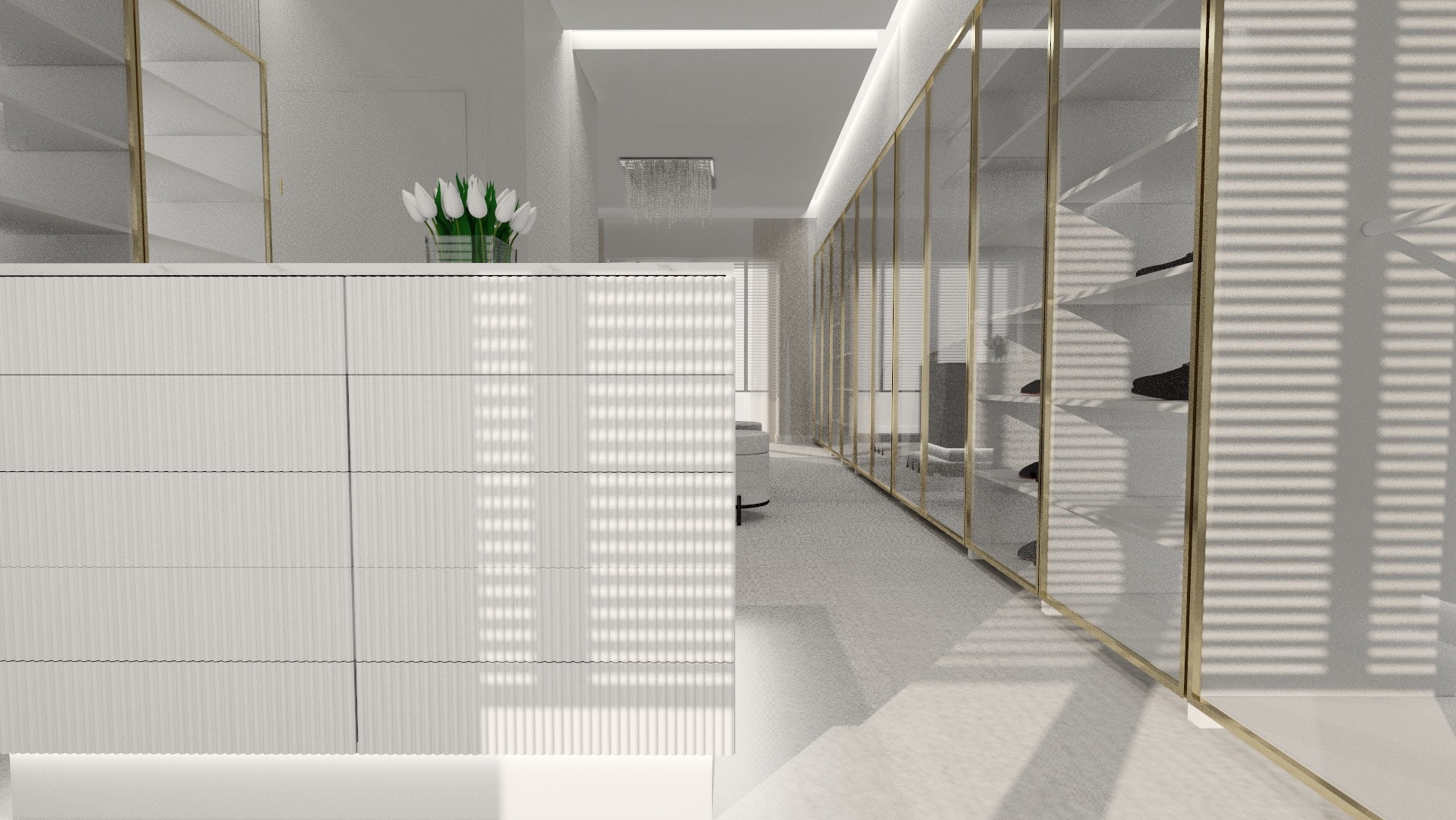 Nowoczesna garderoba z białymi frontami szafek i złotymi ramami szklanych drzwi, uzupełniona kwiatami i oświetleniem sufitowym.