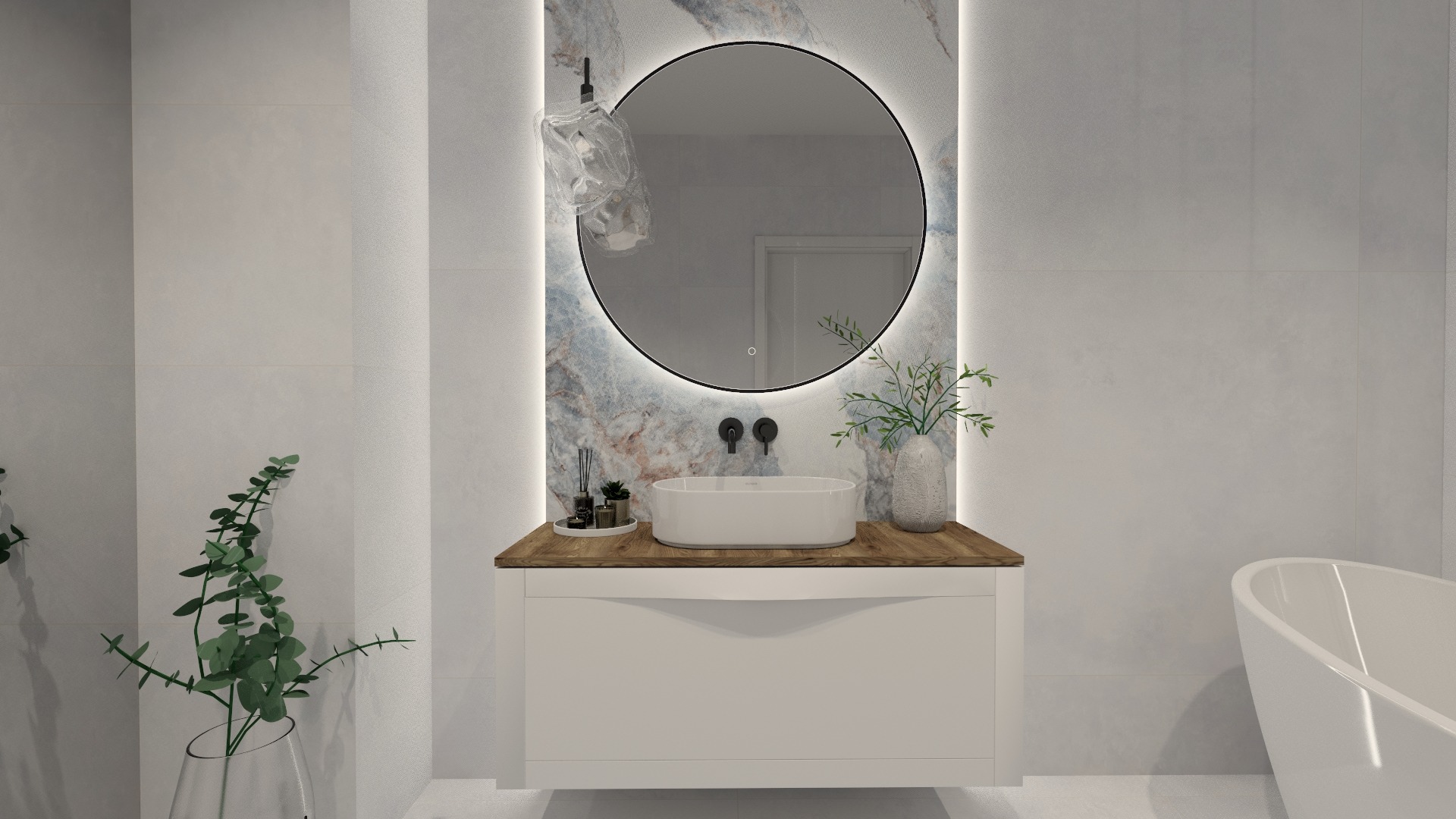 Nowoczesna łazienka z okrągłym lustrem podświetlanym LED, umywalką nablatową i drewnianym blatem. Minimalistyczny design, jasne płytki i subtelne dekoracje roślinne.