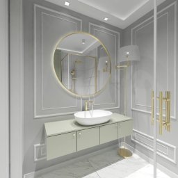 Szejerka Design - Elegancka łazienka w odcieniach szarości z okrągłym lustrem z podświetleniem, wiszącą szafką z umywalką, złotą armaturą i kabiną prysznicową walk-in widoczną w odbiciu lustra.