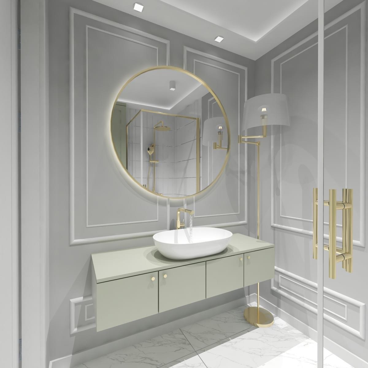 Elegancka łazienka w odcieniach szarości z okrągłym lustrem z podświetleniem, wiszącą szafką z umywalką, złotą armaturą i kabiną prysznicową walk-in widoczną w odbiciu lustra.