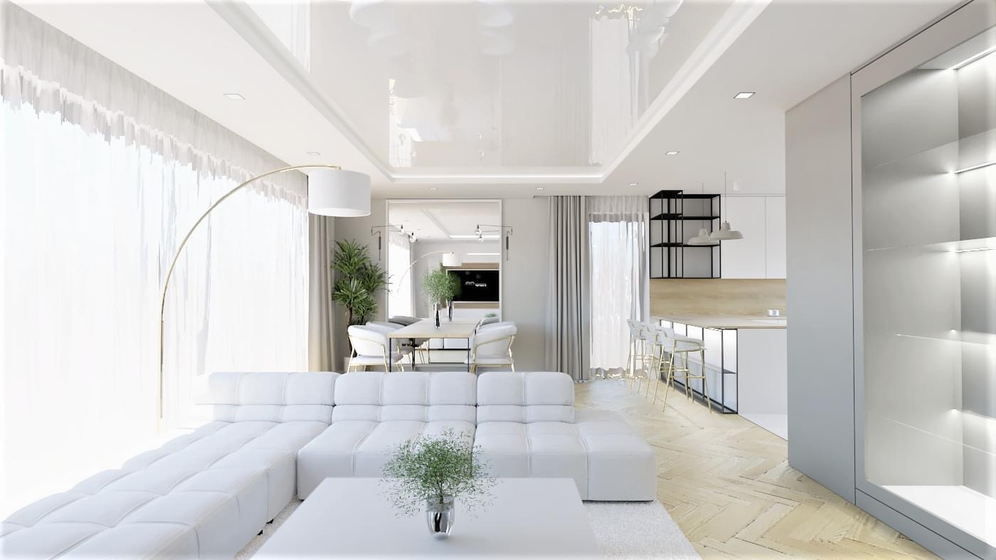 Jasne wnętrze w minimalistycznym stylu: biały narożnik, szklany stolik kawowy z rośliną, złota lampa łukowa, parkiet w jodełkę, kuchnia z barkiem i czarnymi regałami w tle.