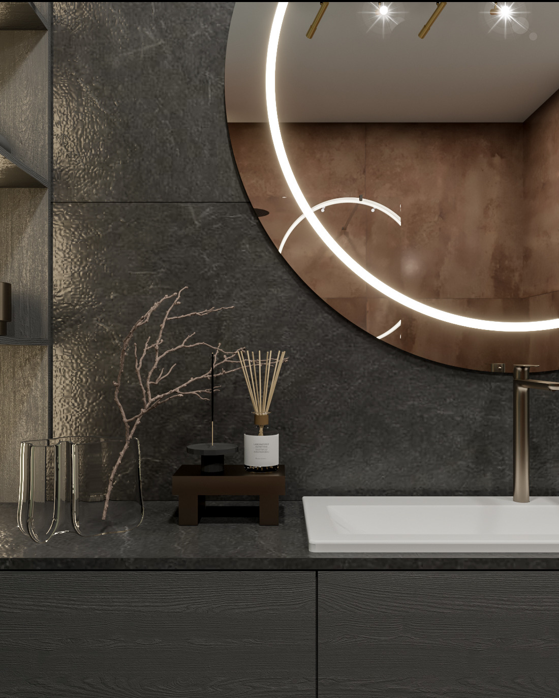 Nowoczesna łazienka z okrągłym lustrem podświetlanym LED, czarnymi szafkami pod umywalką, białym blatem, designerskim wazonem i dyfuzorem zapachowym.