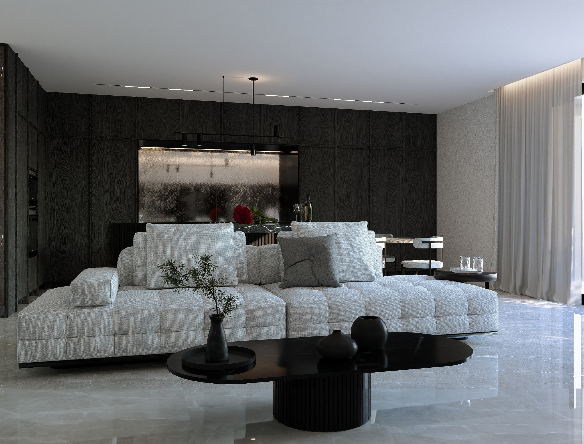 Elegancki salon z modułową sofą w odcieniach szarości, czarnym stolikiem kawowym i ciemną zabudową kuchenną w tle. Minimalistyczny design z akcentami roślinnymi.