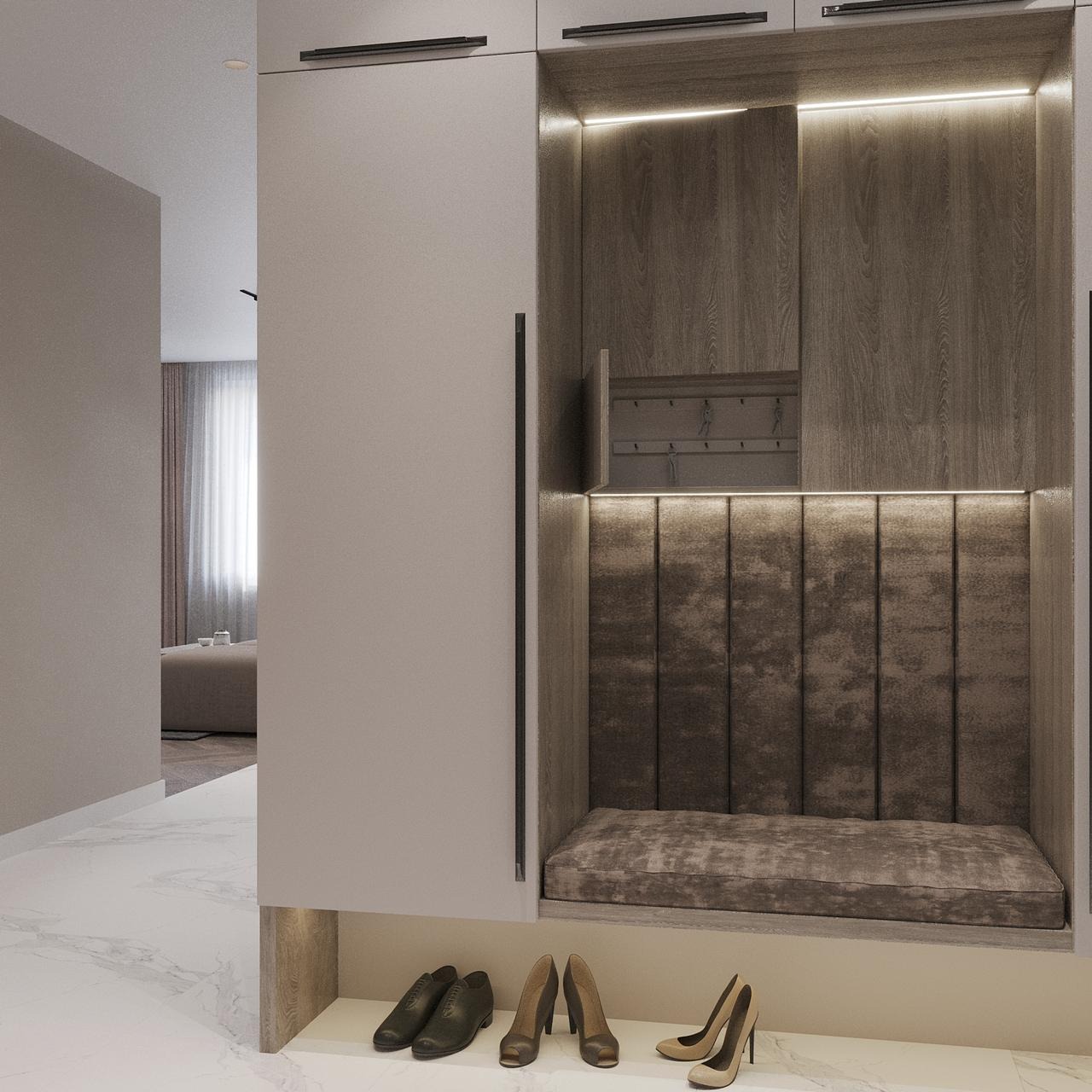 Nowoczesna szafa w przedpokoju z wnęką do siedzenia, podświetleniem LED i miejscem na buty, widok na salon w tle.