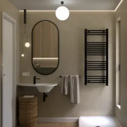 Nowoczesna łazienka z umywalką nablatową, owalnym lustrem w czarnej ramie, grzejnikiem drabinkowym i wiklinowym koszem na pranie, oświetlona kulistą lampą sufitową i wiszącymi lampami punktowymi.