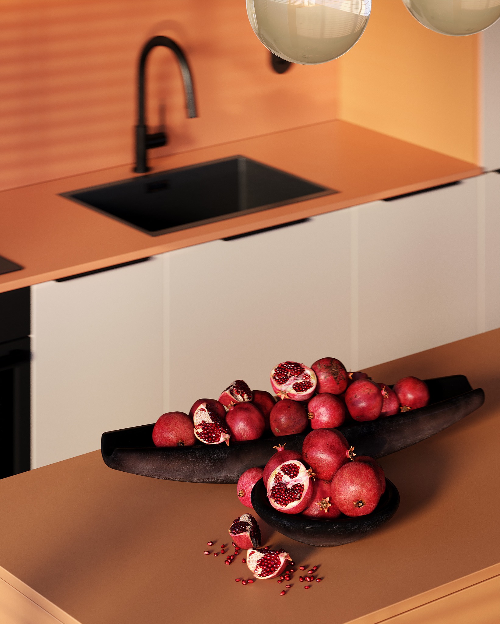 Minimalistyczna kuchnia z czarną armaturą i blatem w odcieniach brązu. Dekoracją są granaty w drewnianych misach, dodające wnętrzu ciepła i naturalnego charakteru.