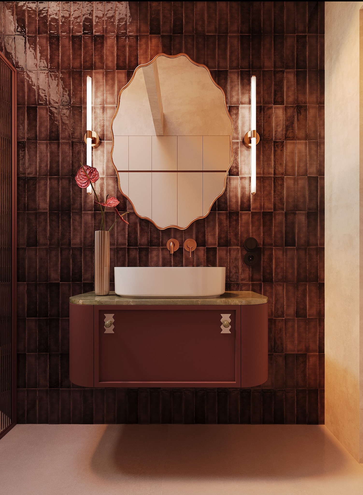 Elegancka łazienka z umywalką nablatową i lustrem w ozdobnej ramie. Ciemnobrązowe płytki na ścianie, minimalistyczna armatura i oświetlenie dodają szyku.