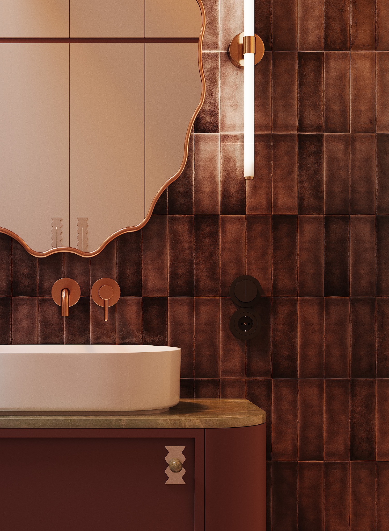 Elegancka łazienka z umywalką nablatową, ozdobnym lustrem i brązowymi płytkami. Uwagę zwracają złote detale armatury i oświetlenia w stylu retro.