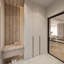 Wnęka z tapicerowanym panelem ściennym, siedziskiem z podświetleniem LED i szafą wnękową z ryflowanymi frontami, uzupełniona o torebkę na siedzisku i buty pod nim.