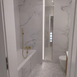 Wykończona łazienka z białymi marmurowymi płytkami na ścianach i podłodze w kształcie sześciokątów, złota armatura, lustro z podświetleniem LED, widok zza otwartych drzwi.