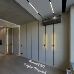 Nowoczesne wnętrze z panelami ściennymi, klimatyzacją, minimalistycznym oświetleniem i betonowym sufitem, widok z poziomu podłogi.