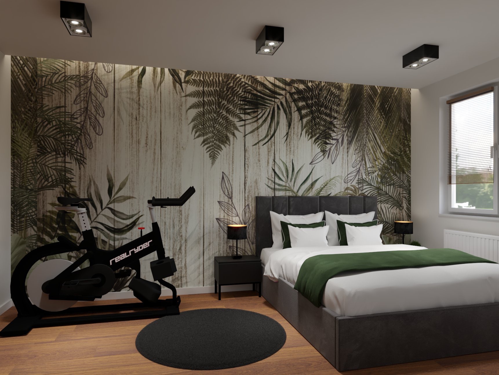 Sypialnia z tapetą w motywy roślinne, łóżkiem z szarą ramą i zielonym pledem, czarnym stolikiem nocnym z lampką oraz rowerem stacjonarnym Realryder na drewnianej podłodze.