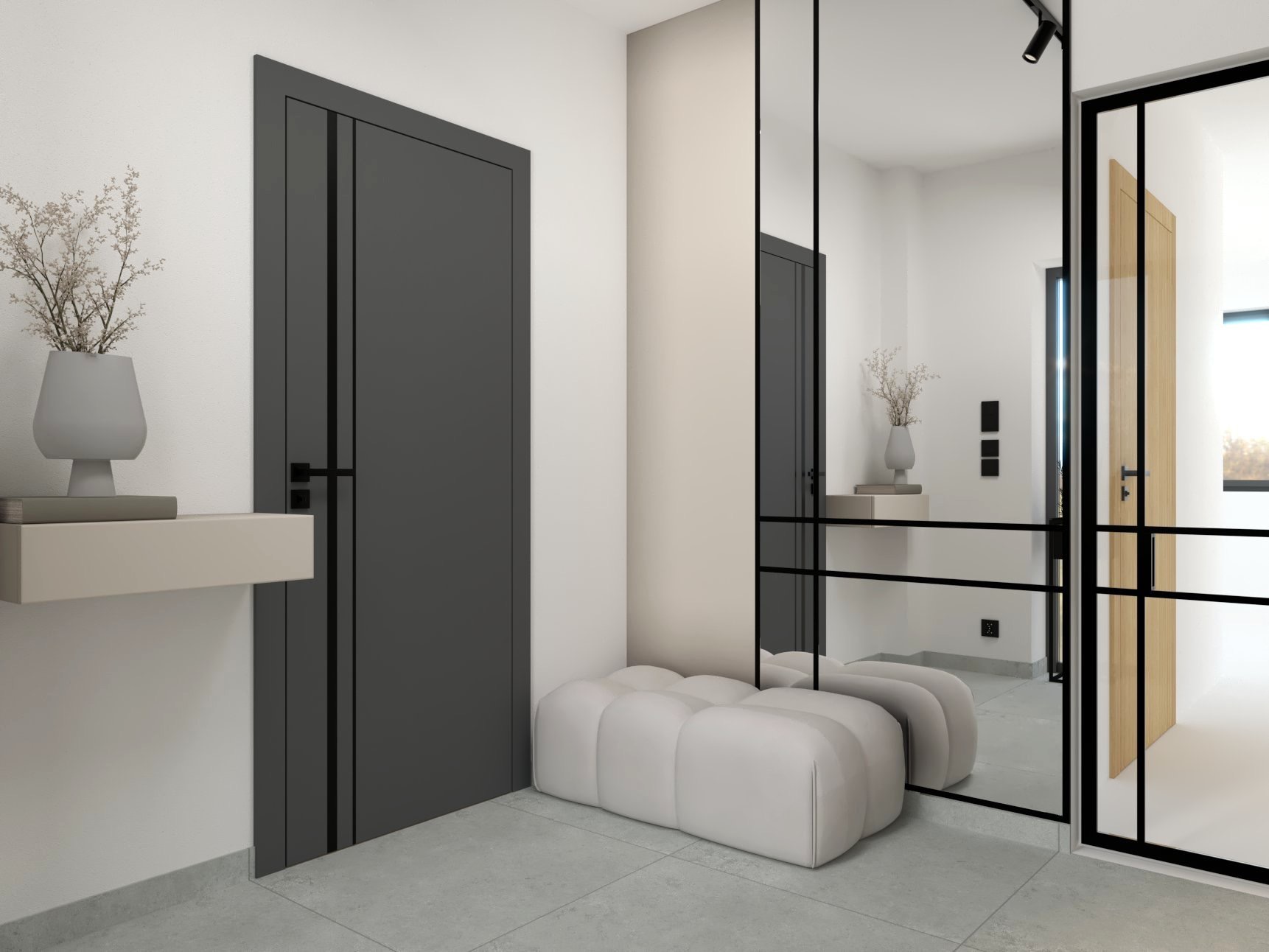 Nowoczesny przedpokój z szarą zabudową drzwiową, minimalistyczną konsolą z dekoracją roślinną i pufą w kształcie chmurki, odbity w lustrze z czarnymi szprosami.