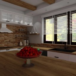 Katarzyna Zasadzińska Projekty Wnętrz - Nowoczesna kuchnia z ceglaną ścianą, białymi szafkami, drewnianym blatem i drewnianymi belkami na suficie, z misą czereśni na pierwszym planie.