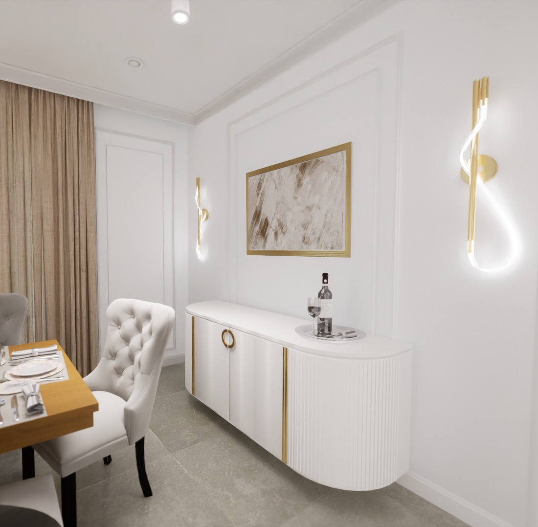 Elegancka jadalnia w jasnych barwach z białym kredensem z dekoracyjnymi złotymi elementami, obrazem w złotej ramie i nowoczesnymi złotymi kinkietami. Stół z nakryciem i krzesłem w stylu glamour.