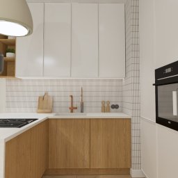 MATO PROJEKT pracownia projektowa - Wizualizacja nowoczesnej kuchni z białymi szafkami górnymi, drewnianymi szafkami dolnymi, białym blatem, czarną płytą indukcyjną, miedzianą baterią i pionowymi płytkami na ścianie