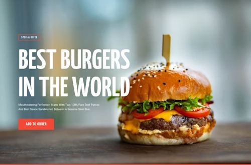 Apetyczny hamburger z podwójnym mięsem, serem, pomidorami i sałatą, spięty wykałaczką, na drewnianym blacie z rozmytym tłem i napisem 'BEST BURGERS IN THE WORLD'.