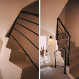 Probud Piotr Rosinski - Minimalistyczne schody z czarną, metalową balustradą i subtelnym oświetleniem. W tle okno z dekoracyjną trawą pampasową. Stonowana kolorystyka ścian.