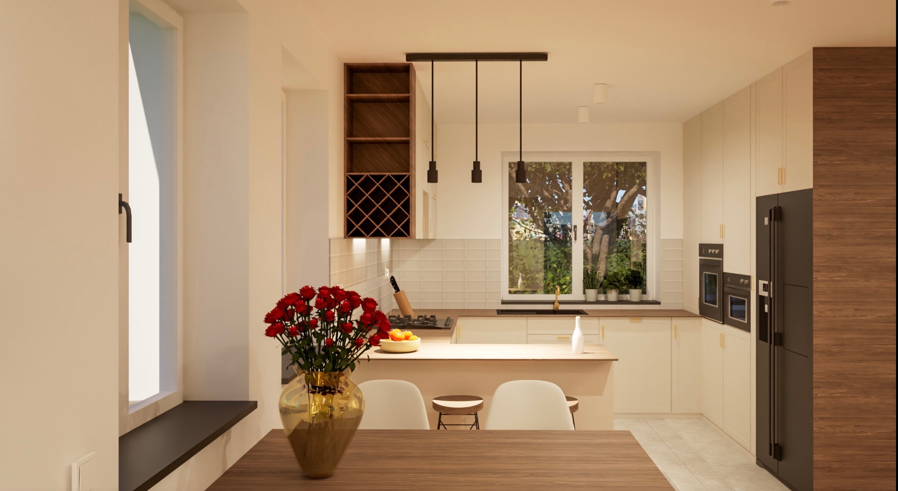 Wnętrze jasnej, nowoczesnej kuchni z drewnianym stołem na pierwszym planie, na którym stoi wazon z czerwonymi różami. W tle widoczna zabudowa kuchenna z szafkami w kolorze kremowym, czarną lodówką...