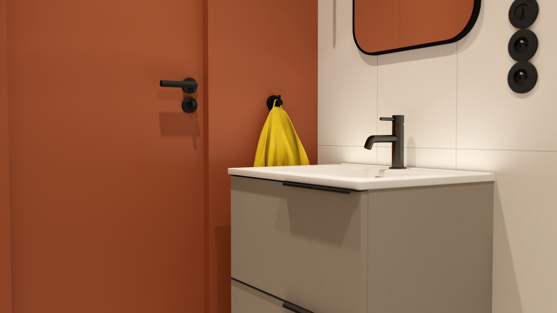 Nowoczesna łazienka z umywalką nablatową, czarną armaturą, pomarańczowymi akcentami na drzwiach i lustrze oraz żółtym ręcznikiem na wieszaku.