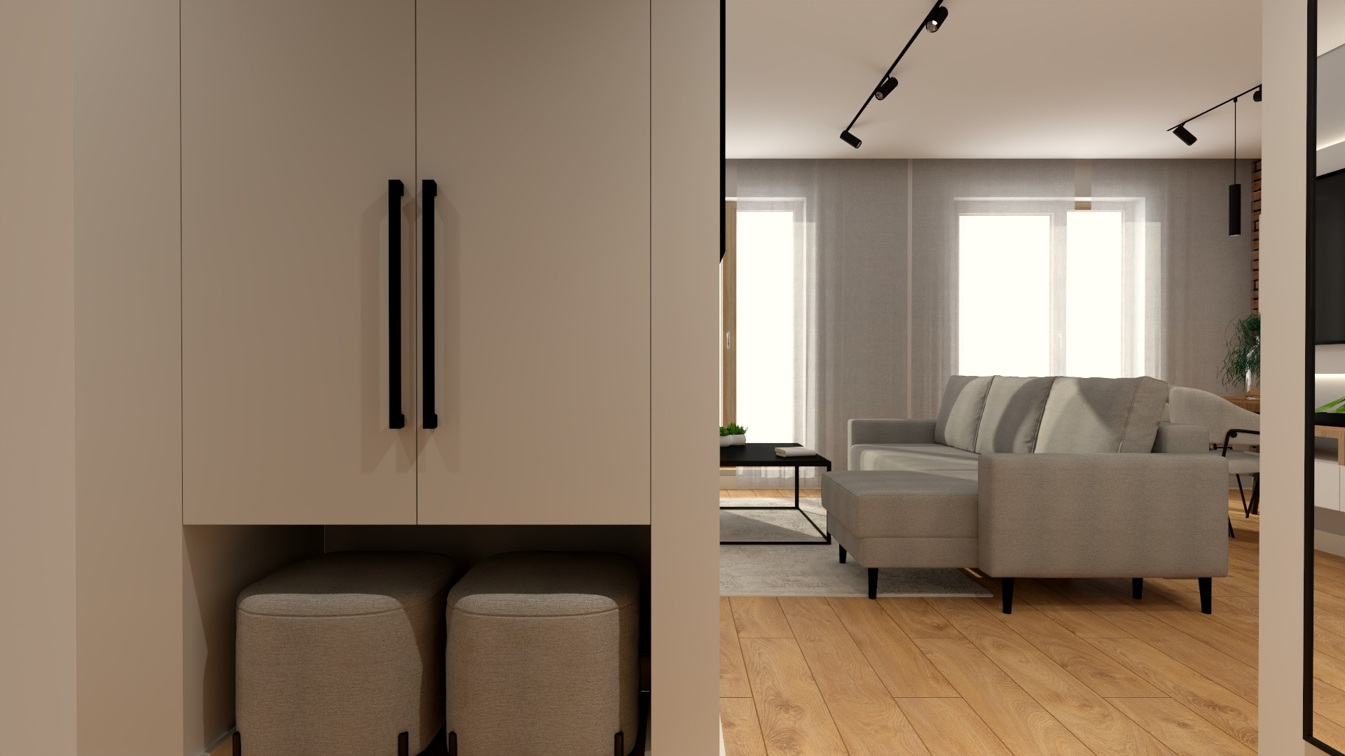 Wnętrze mieszkania w neutralnych barwach: zabudowa meblowa z pufami, szara sofa z pufem, drewniana podłoga, oświetlenie punktowe.