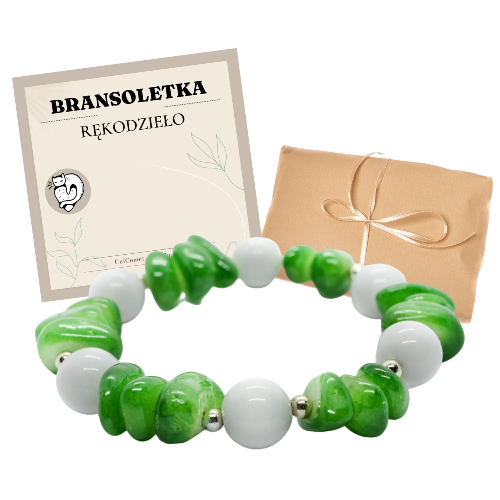 Ręcznie robiona bransoletka z zielonych i białych kamieni, prezentowana obok brązowego pudełka z kokardą i certyfikatu rękodzieła z logo firmy UniComet.