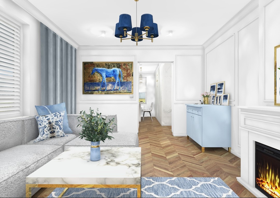 Salon w jasnych barwach z szarą sofą narożną, marmurowym stolikiem kawowym, błękitną komodą i obrazem z motywem niebieskiego konia na ścianie.