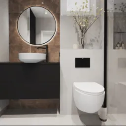 Nowoczesna łazienka z okrągłym lustrem podświetlanym LED, wiszącą miską WC i umywalką nablatową na czarnej szafce, całość w stonowanej kolorystyce z akcentami brązu.