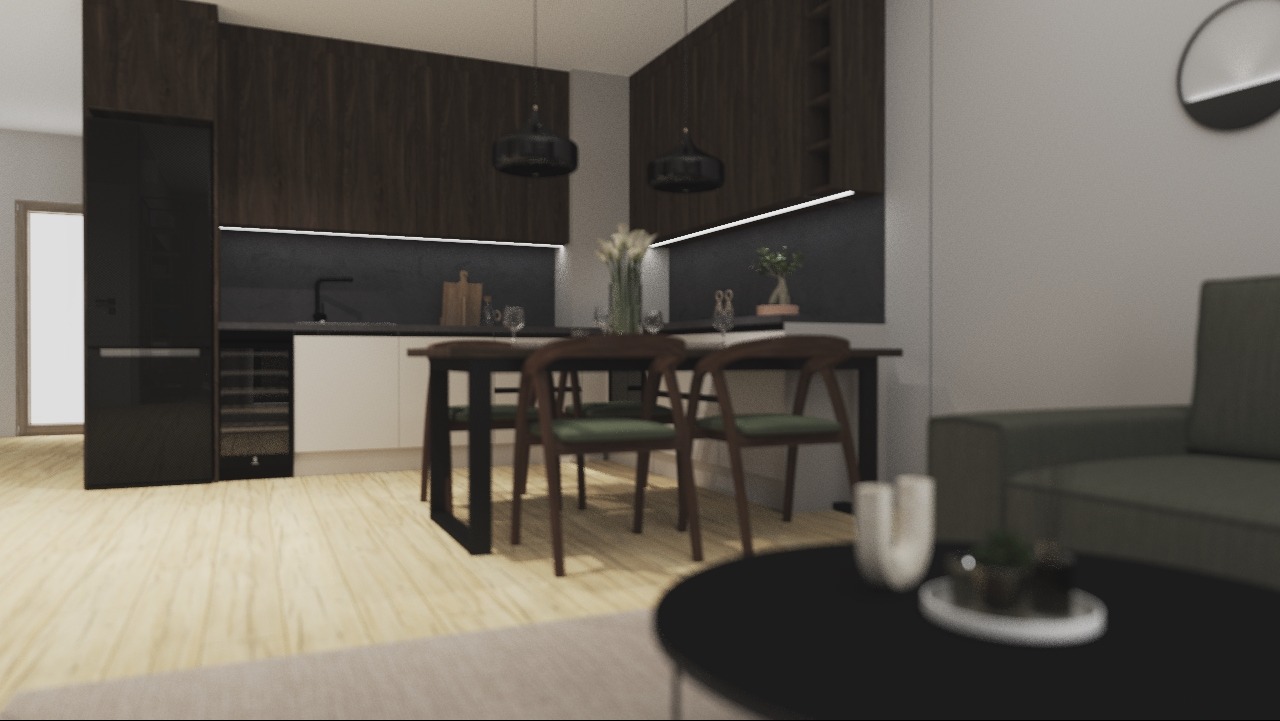 Nowoczesna kuchnia z ciemnymi, drewnianymi szafkami, białymi frontami, czarnym blatem, oświetleniem LED pod szafkami, stołem z krzesłami z zielonymi siedziskami i sofą w tle.