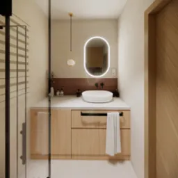 Nowoczesna aranżacja łazienki z owalnym lustrem podświetlanym LED, drewnianą szafką pod umywalką i minimalistyczną armaturą w kolorze czarnym.