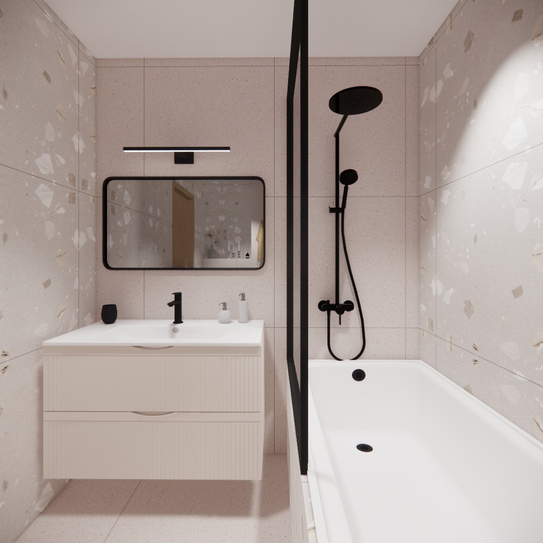 Nowoczesna łazienka z beżowymi płytkami lastryko, białą szafką pod umywalką z frezowanymi frontami, czarną armaturą i prostokątnym lustrem z zaokrąglonymi rogami.