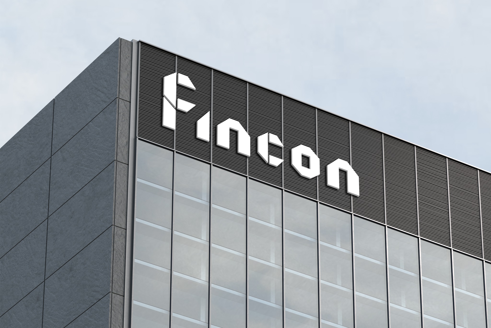 Biurowiec z nowoczesnym logo firmy 'Fincon' na fasadzie, widoczne z dołu pod kątem.