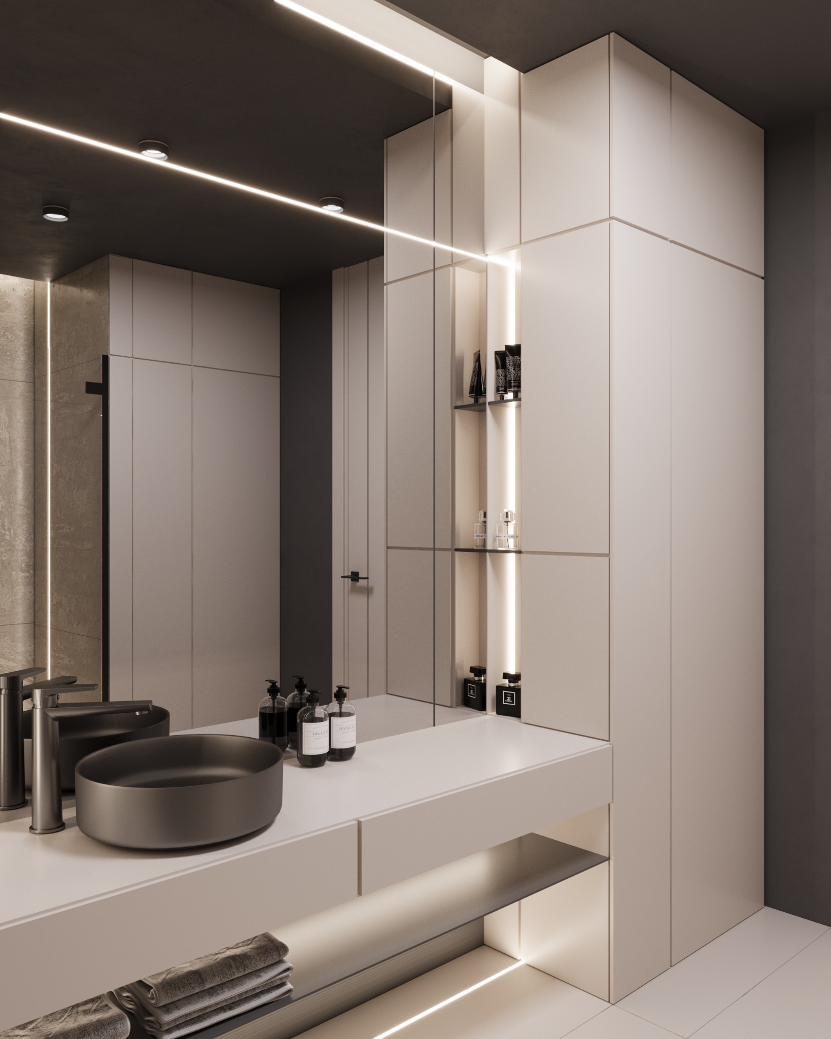 Minimalistyczna łazienka z owalną umywalką nablatową w kolorze grafitowym, baterią w odcieniu szczotkowanego metalu, kosmetykami w czarnych opakowaniach i podświetlanymi półkami.