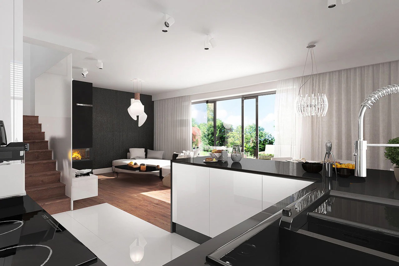 Nowoczesne wnętrze domu z otwartą kuchnią, schodami i kominkiem, utrzymane w bieli, czerni i drewnie, z dużym oknem na ogród i designerskimi lampami.