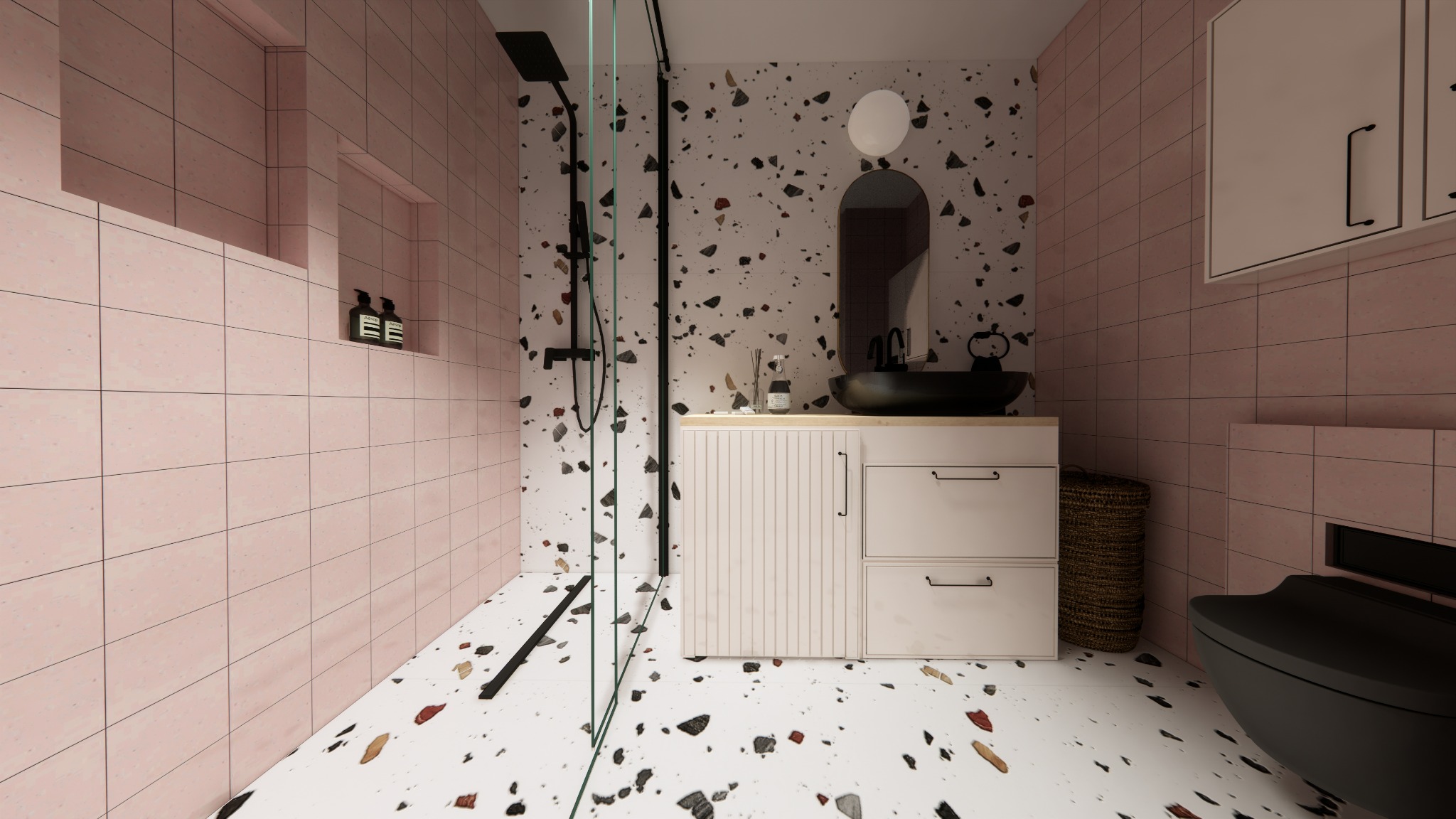 Nowoczesna łazienka w Krakowie z różowymi płytkami i podłogą w stylu terrazzo, czarna armatura, owalne lustro nad umywalką i kabina prysznicowa ze szklaną ścianką.