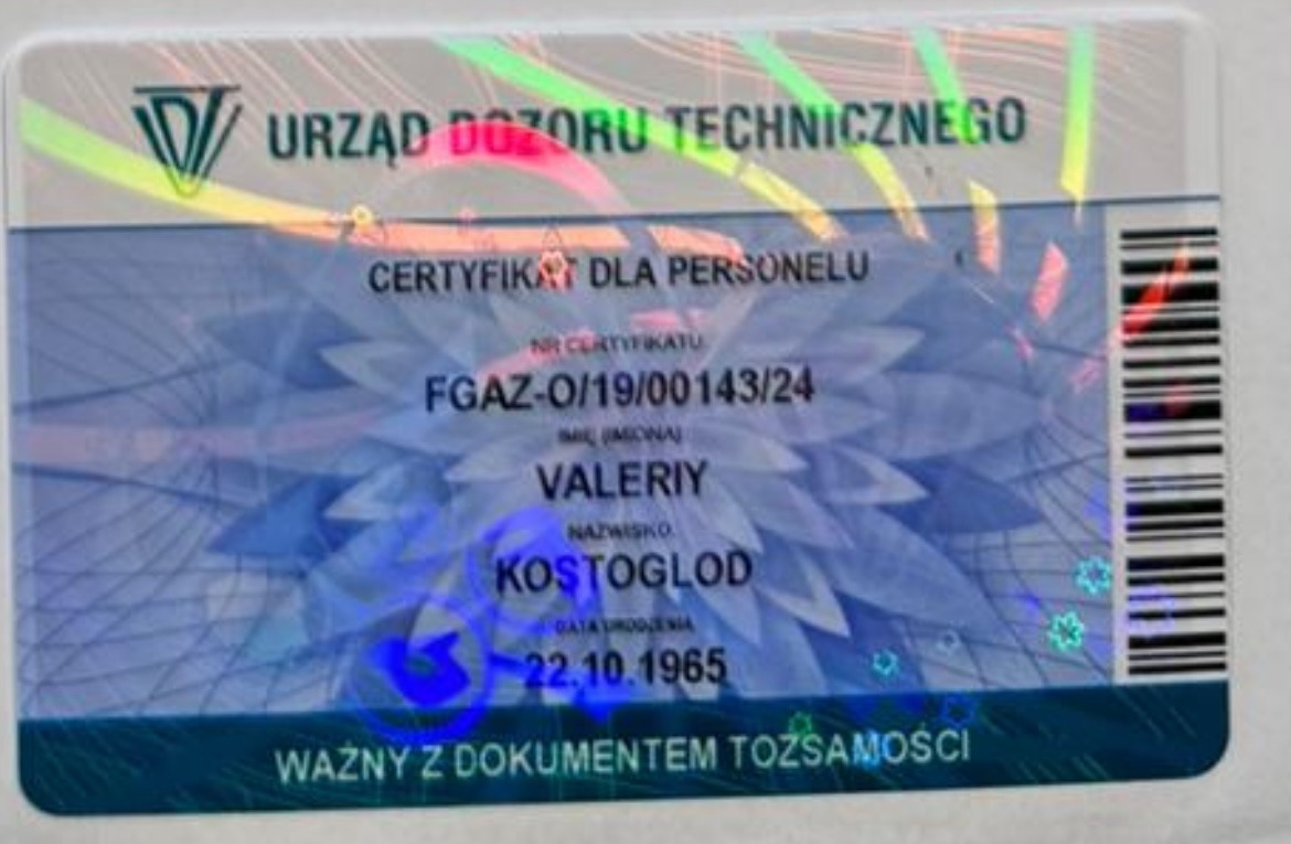 Skan certyfikatu Urzędu Dozoru Technicznego dla personelu, numer FGAZ-O/19/00143/24, imię Valeriy Kostoglod, data urodzenia 22.10.1965, ważny z dokumentem tożsamości, z hologramem i kodem kreskowym.