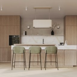 Katarzyna Trzepałka KATYO STUDIO - Nowoczesna kuchnia z drewnianymi szafkami, marmurowym blatem i trzema zielonymi hokerami na tle parkietu w jodełkę.