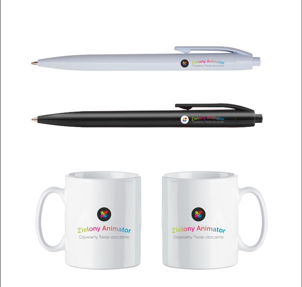 Dwa długopisy (biały i czarny) oraz dwa białe kubki z nadrukowanym logo 'Zielony Animator Ożywiamy Twoje otoczenie', ułożone na białym tle.