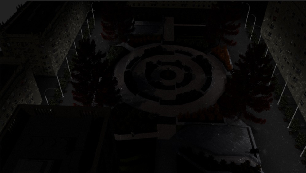 Nocny widok z góry na okrągły labirynt w parku miejskim, otoczony budynkami i oświetlony latarniami.