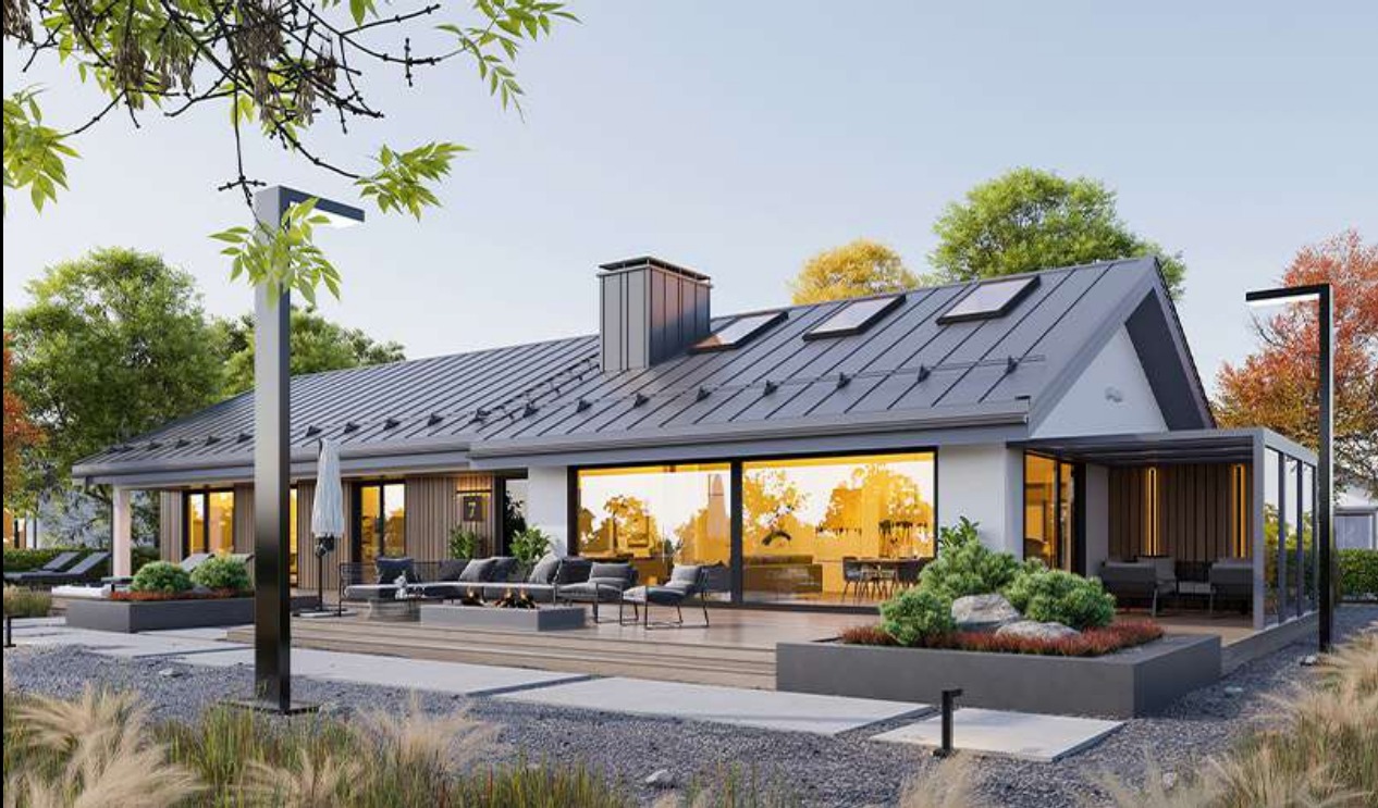 Wizualizacja parterowego domu murowanego z grafitowym dachem, dużymi przeszkleniami i tarasem z meblami ogrodowymi oraz oświetleniem zewnętrznym.